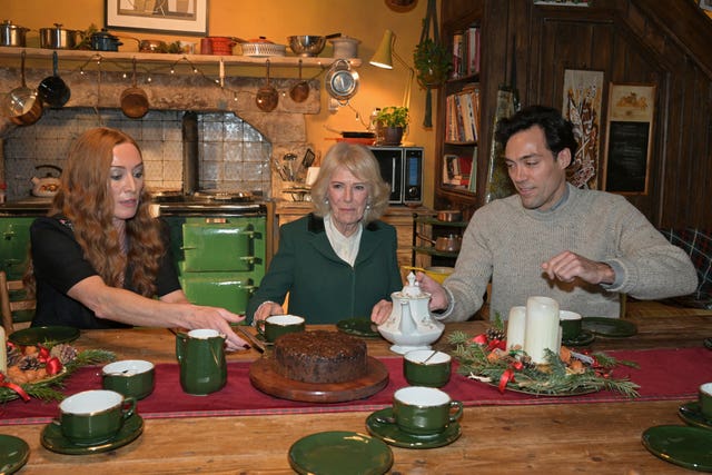 The Queen taking tea on set with Rivals actors Victoria Smurfit and Alex Hassell in Bristol 