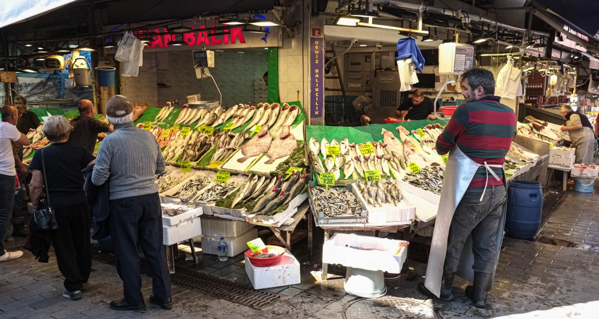 A worker at a seafood stall in an Istanbul farmers market
