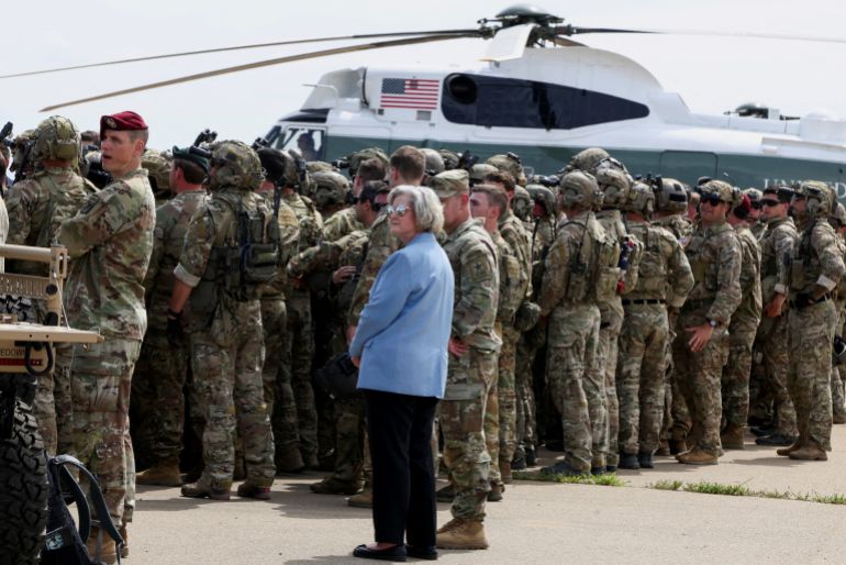 White House Chief of Staff Susie Wiles stands with U.S. Army members during U.S. President Donald Trump's visit to Fort Bragg to mark the U.S. Army anniversary, in North Carolina, U.S., June 10, 2025. REUTERS/Evelyn Hockstein