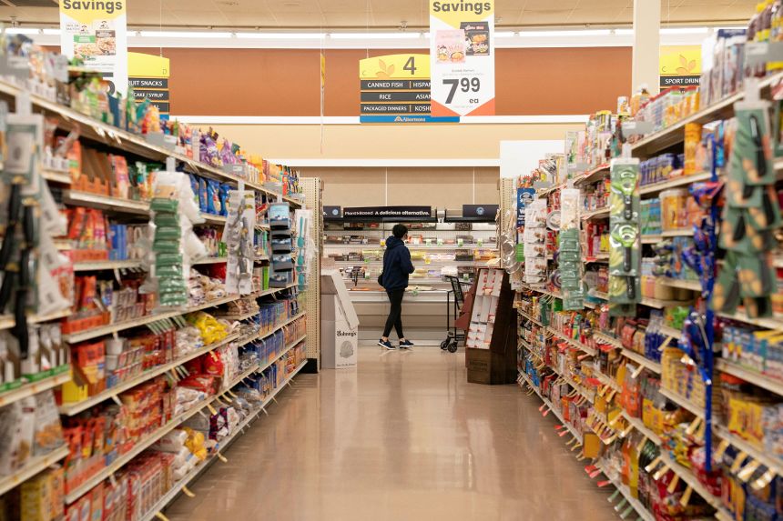 A food shopper browses for groceries ahead of the Thanksgiving Day holiday at an Albertsons supermarket in Redmond, Washington, on November 24, 2025.
