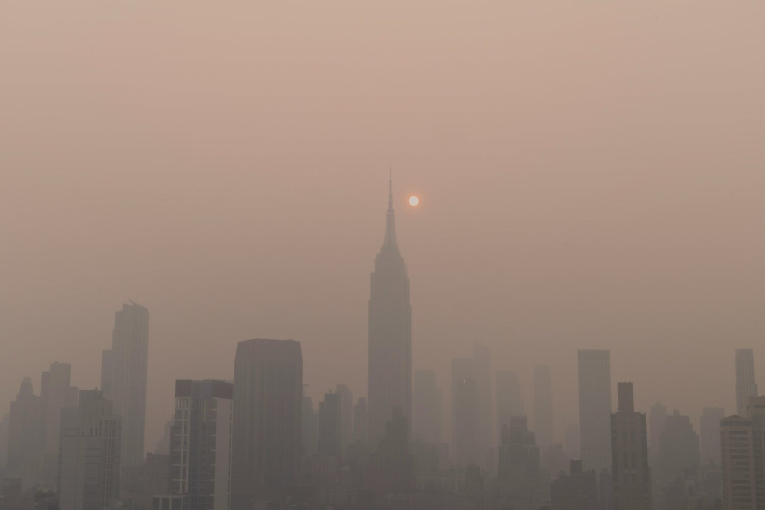 Urban haze highlights the growing intersection of climate change, public health, and infrastructure risk. Credit: Unsplash+