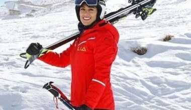 Iranian skier who had fled to Germany makes homecoming, praises Khamenei