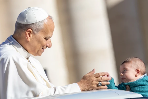 Pope Leo XIV greets a baby at his general audience in St. Peter's Square at the Vatican, Wednesday, Oct. 8, 2025. Credit: Daniel Ibáñez/CNA