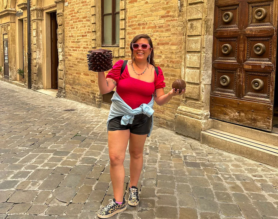 A woman holding a traditional Bracciale in Marche, Italy