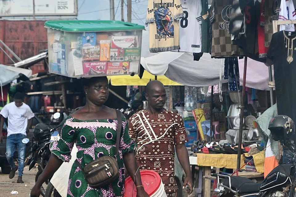 People in a market in the Togolese capital.