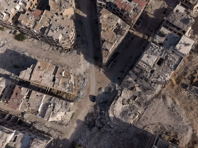 An aerial view shows the destruction to the city of Harasta, resulting in widespread poverty, damage to infrastructure and a collapse of services. Moawia Atrash/dpa