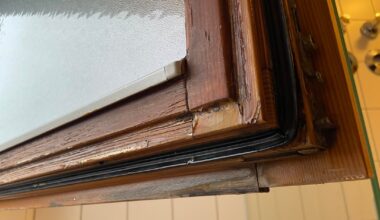 Flaking and molding wooden window in winter