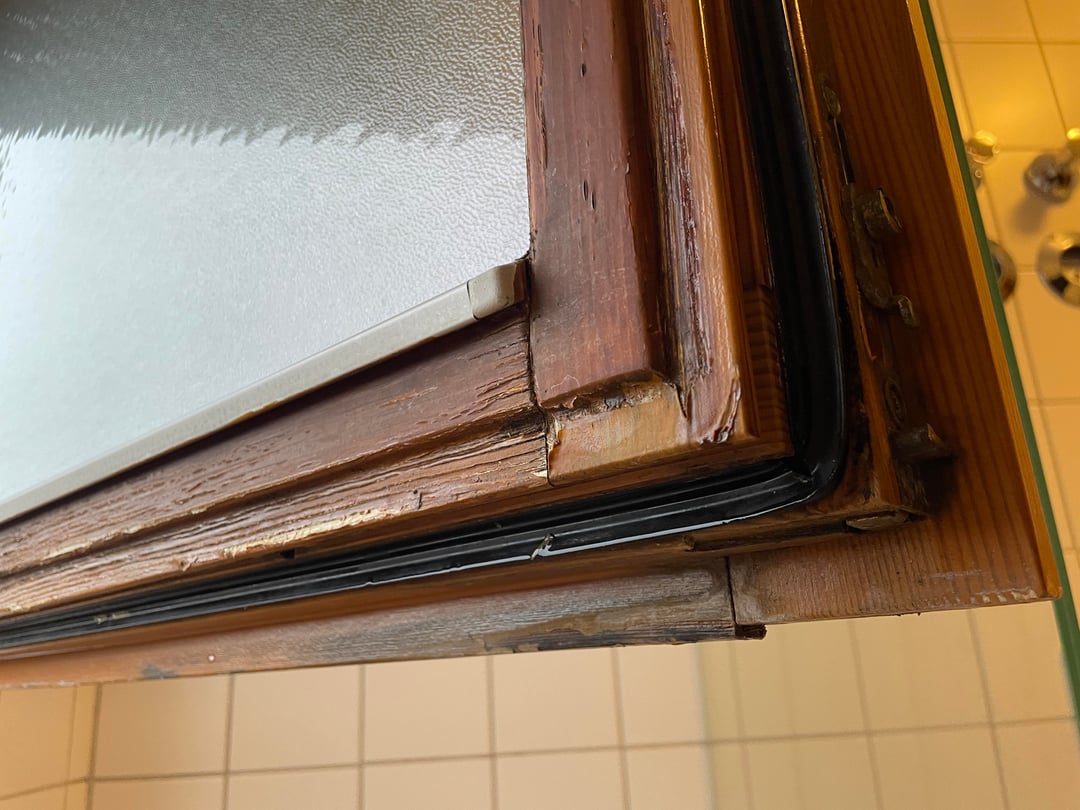 Flaking and molding wooden window in winter