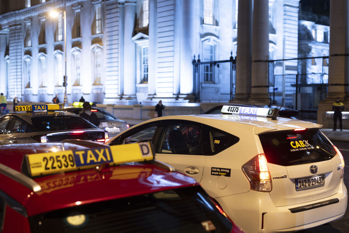  Dublin taxi drivers protesting against Uber outside Government Buildings in Dublin on December 3. There was also a protest attended by 200 drivers in Cork. See below. Picture: Sam Boal/Collins