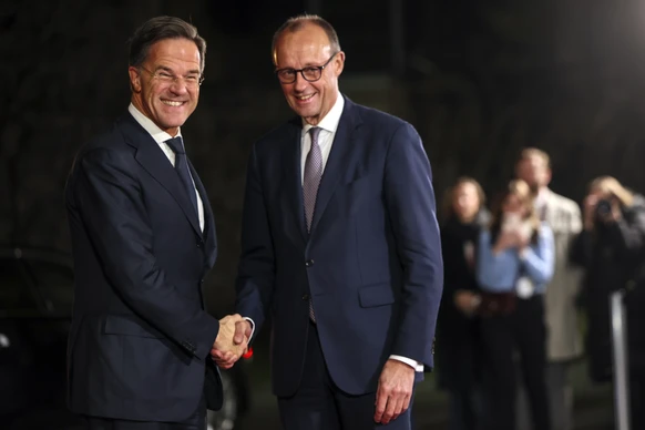 epa12594590 German Chancellor Friedrich Merz (R) welcomes NATO Secretary-General Mark Rutte (L) at the Federal Chancellery in Berlin, Germany, 15 December 2025. Berlin hosts US-Ukraine negotiations on ...