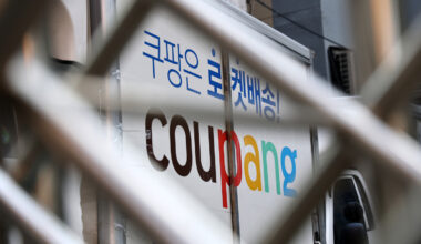 A Coupang delivery truck is seen through a fence in one of the e-commerce company's logistics centers in Seoul on Dec. 7. [YONHAP]