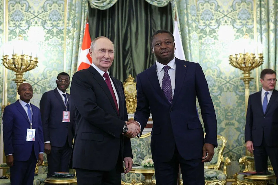 Russia's President Vladimir Putin and Togo's President of the Council of Ministers Faure Gnassingbé shake hands as they meet at the Kremlin in Moscow.