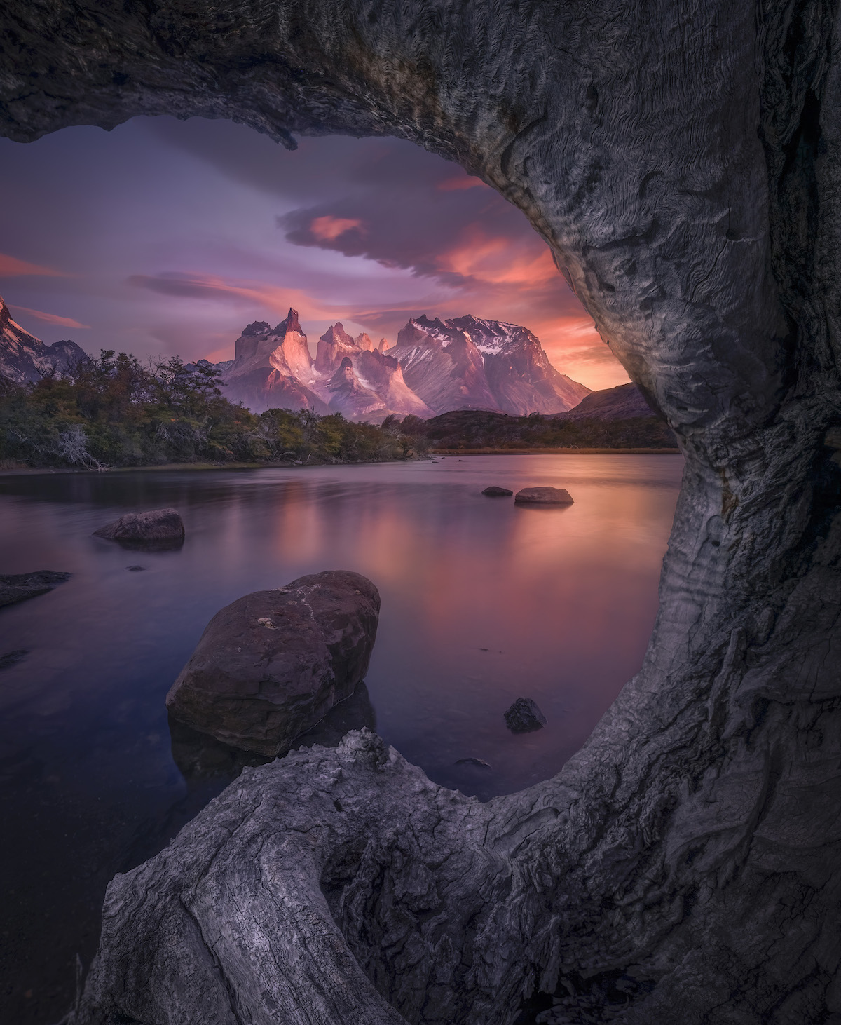 pink sunrise over a lake and mountains