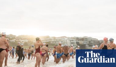 A swim for unity at Bondi beach, the scene of Sydney’s darkest day. But on land tensions fray | Bondi beach terror attack