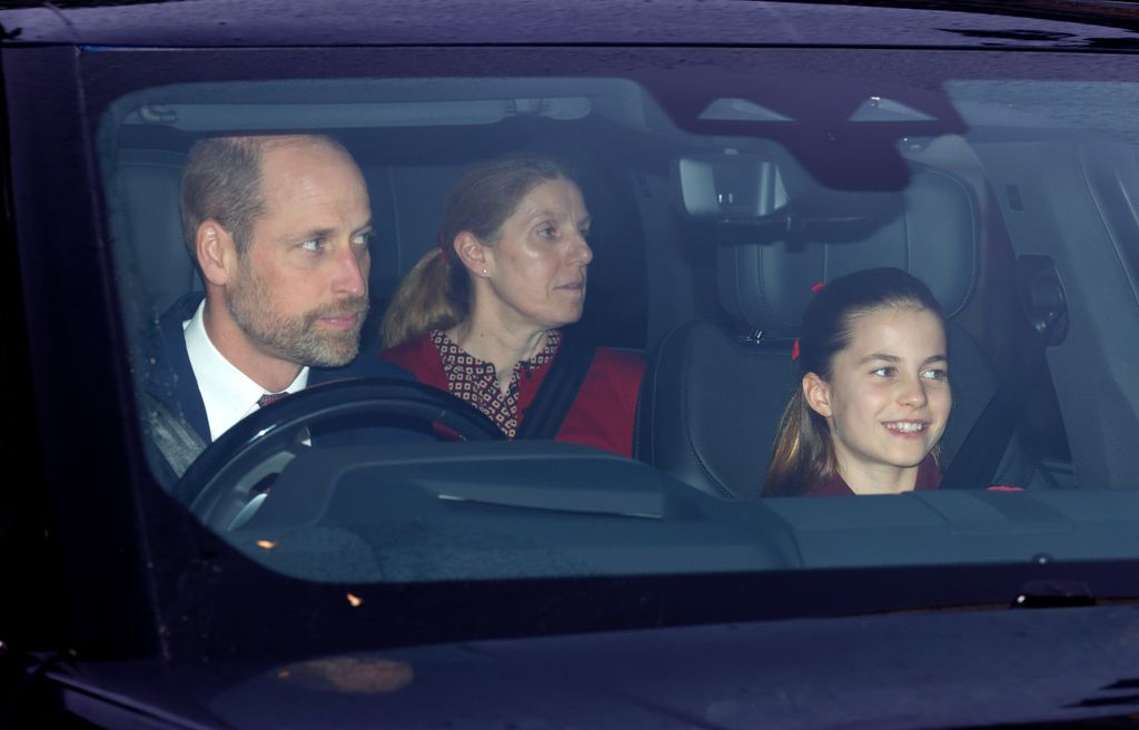 A man, a woman and a child sitting in a car