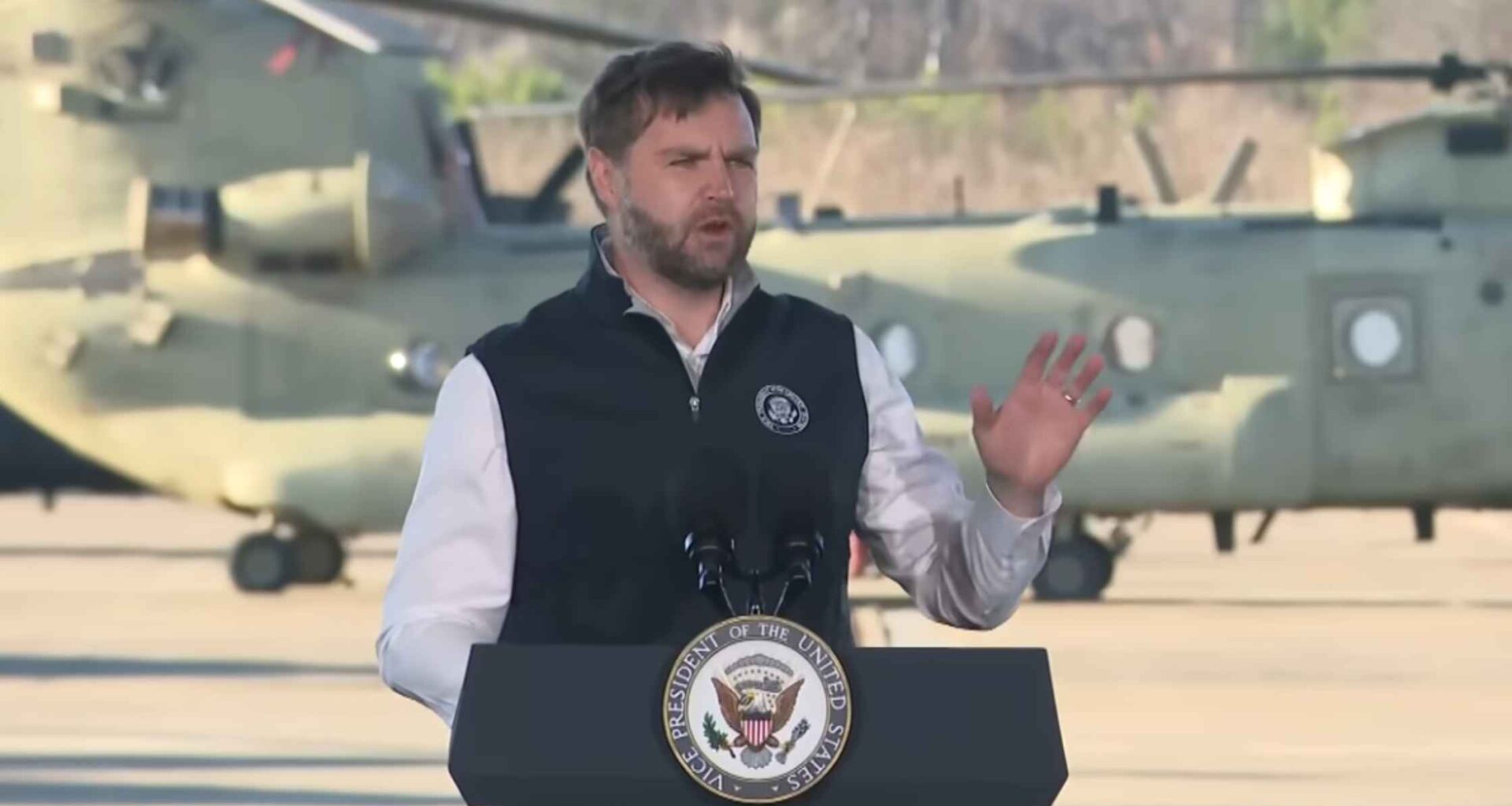 JD Vance speaks and gestures to troops.