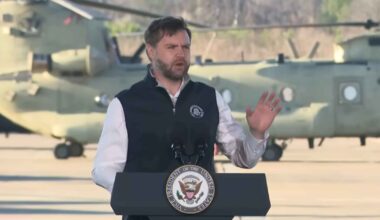 JD Vance speaks and gestures to troops.