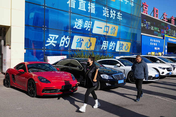 High-end car sales sink in China as its economy slows, taking a toll on European automakers