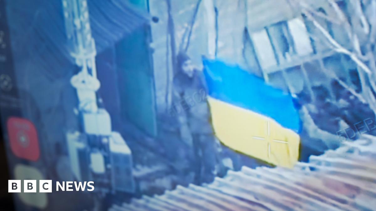 Ukrainians raise flag to show BBC the fight goes on in city claimed by Russia