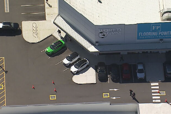 Police cordon off an area of the car park outside World Gym.