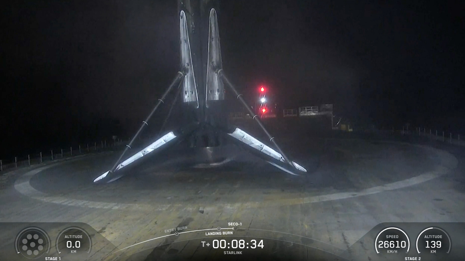 a rocket rests on the deck of a ship at night