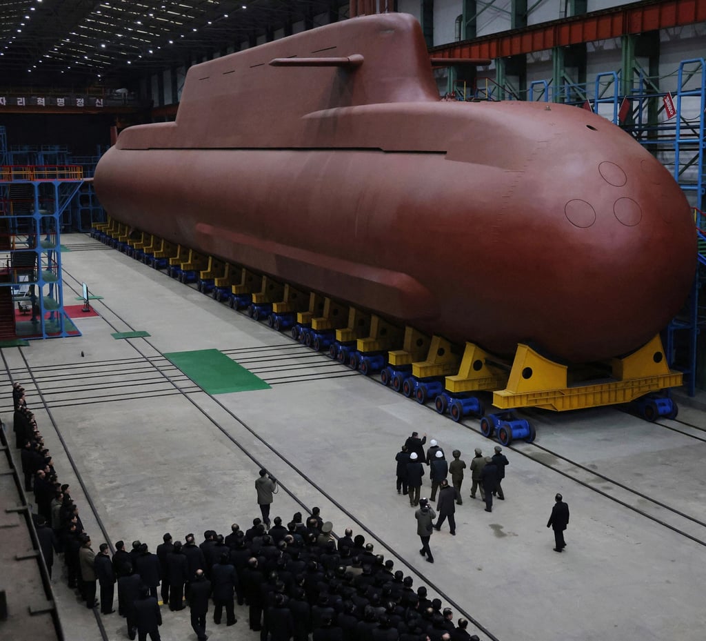 The scale of a nuclear-powered submarine under construction in North Korea can be seen in a photo released on December 25. Photo: KCNA/AP The scale of a nuclear-powered submarine under construction in North Korea can be seen in a photo released on December 25. Photo: KCNA/AP