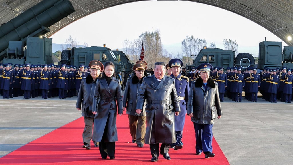 North Korea’s Kim Jong-un (centre) is seen accompanied by his daughter Ju-ae at Friday’s air force anniversary event. Photo: KCNA/KNS/AFP