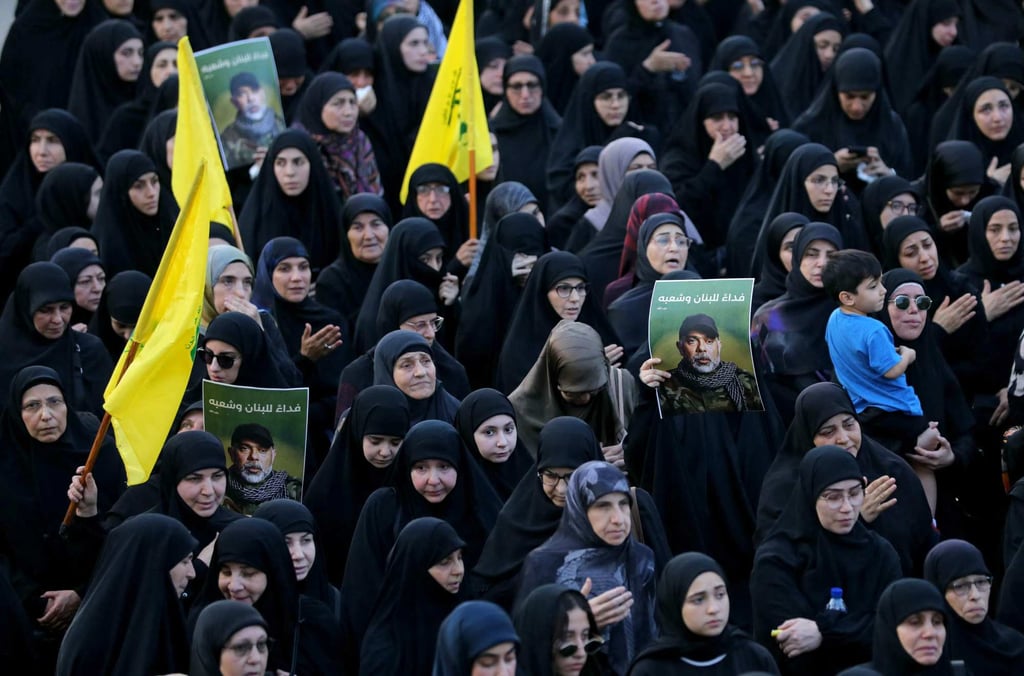 Mourners carry pictures of Hezbollah military chief Haytham Ali al-Tabatabai, who was killed in an Israeli strike a day earlier, during his funeral on November 24. Photo: AFP Mourners carry pictures of Hezbollah military chief Haytham Ali al-Tabatabai, who was killed in an Israeli strike a day earlier, during his funeral on November 24. Photo: AFP