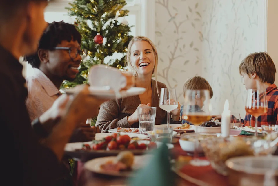 Family having a festive meal at home. (Getty Images)