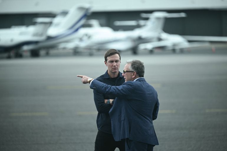 US special envoy to the Middle East Steve Witkoff (R) and Jared Kushner await the arrival of President Donald Trump and First Lady Melania Trump at Teterboro Airport in Teterboro, New Jersey, from where they will motorcade to attend the 2025 FIFA Club World Cup final football match between England's Chelsea and France's Paris Saint-Germain at MetLife Stadium in East Rutherford, New Jersey, on July 13, 2025. (Photo by Brendan SMIALOWSKI / AFP)