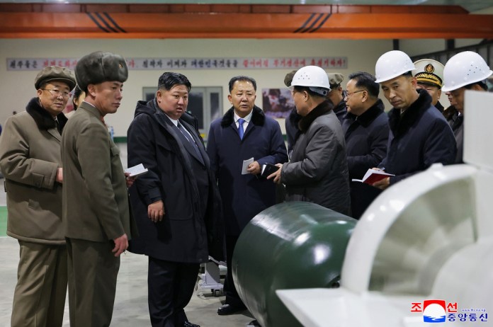 North Korean leader Kim Jong Un visits a shipyard as he inspects a nuclear-powered submarine under construction.