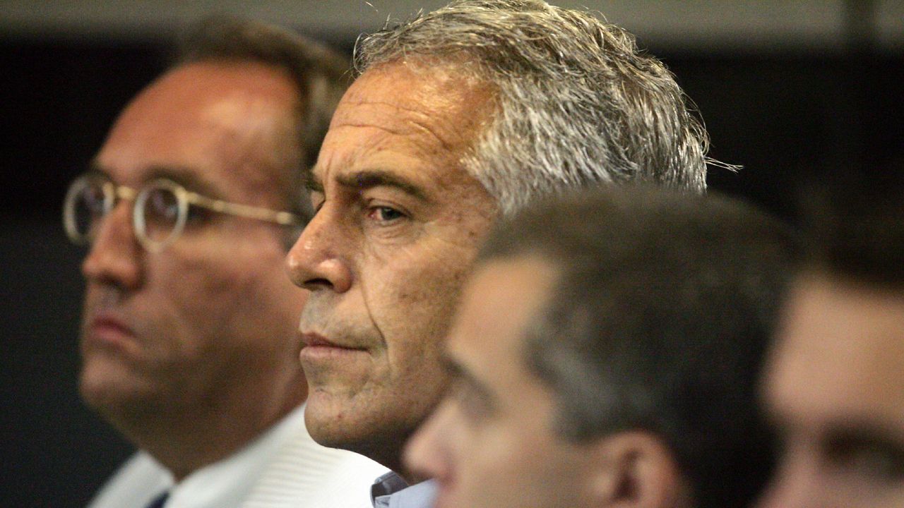 In this July 30, 2008, file photo, Jeffrey Epstein, center, appears in court in West Palm Beach, Fla. (Uma Sanghvi/The Palm Beach Post via AP, File)