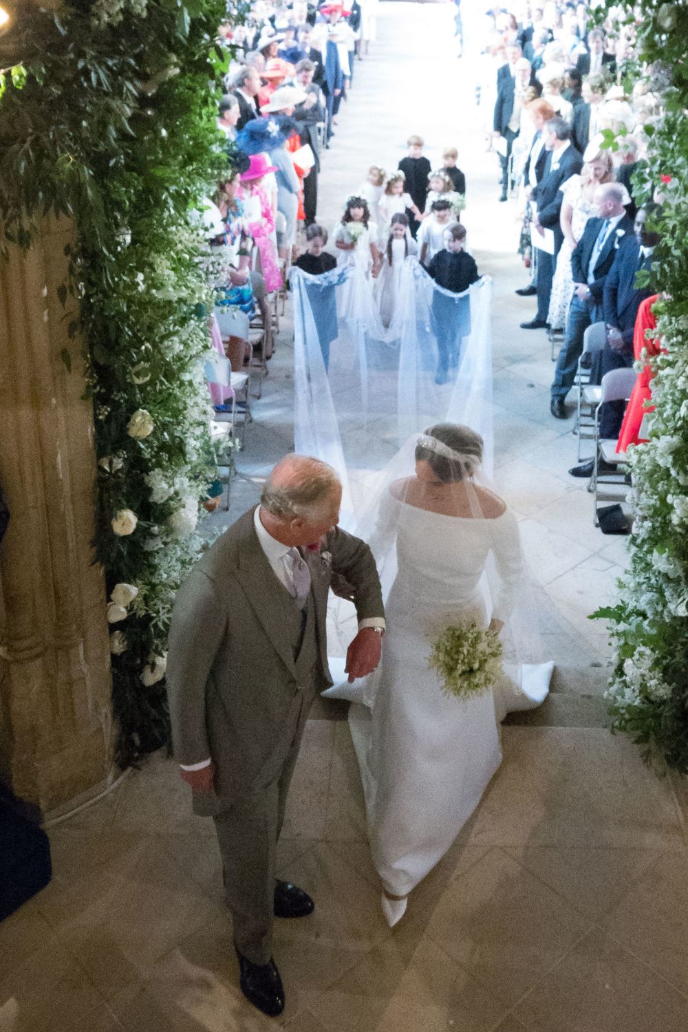 King Charles walks Meghan Markle down the aisle at her wedding to Prince Harry in 2018