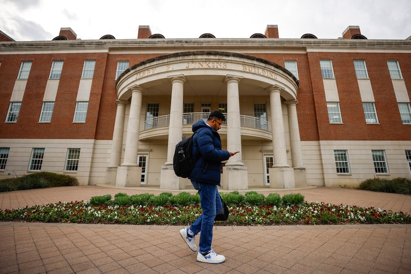 A student walked in front of J. Lindsay Embrey Engineering at Southern Methodist University...