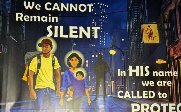 The silhouetted figure behind the Latino family in the Nativity image outside Claremont United Methodist Church is meant to represent an ICE agent. For nearly 20 years the church has looked at the traditional story through a contemporary lens. (Photo by David Allen, Inland Valley Daily Bulletin/SCNG)