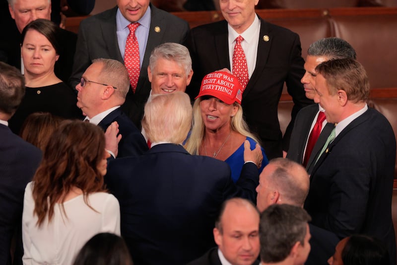 U.S. President Donald Trump greets Rep. Marjorie Taylor Greene (R-GA) after addressing a joint session of Congress at the U.S. Capitol on March 04, 2025 in Washington, DC. President Trump was expected to address Congress on his early achievements of his presidency and his upcoming legislative agenda.