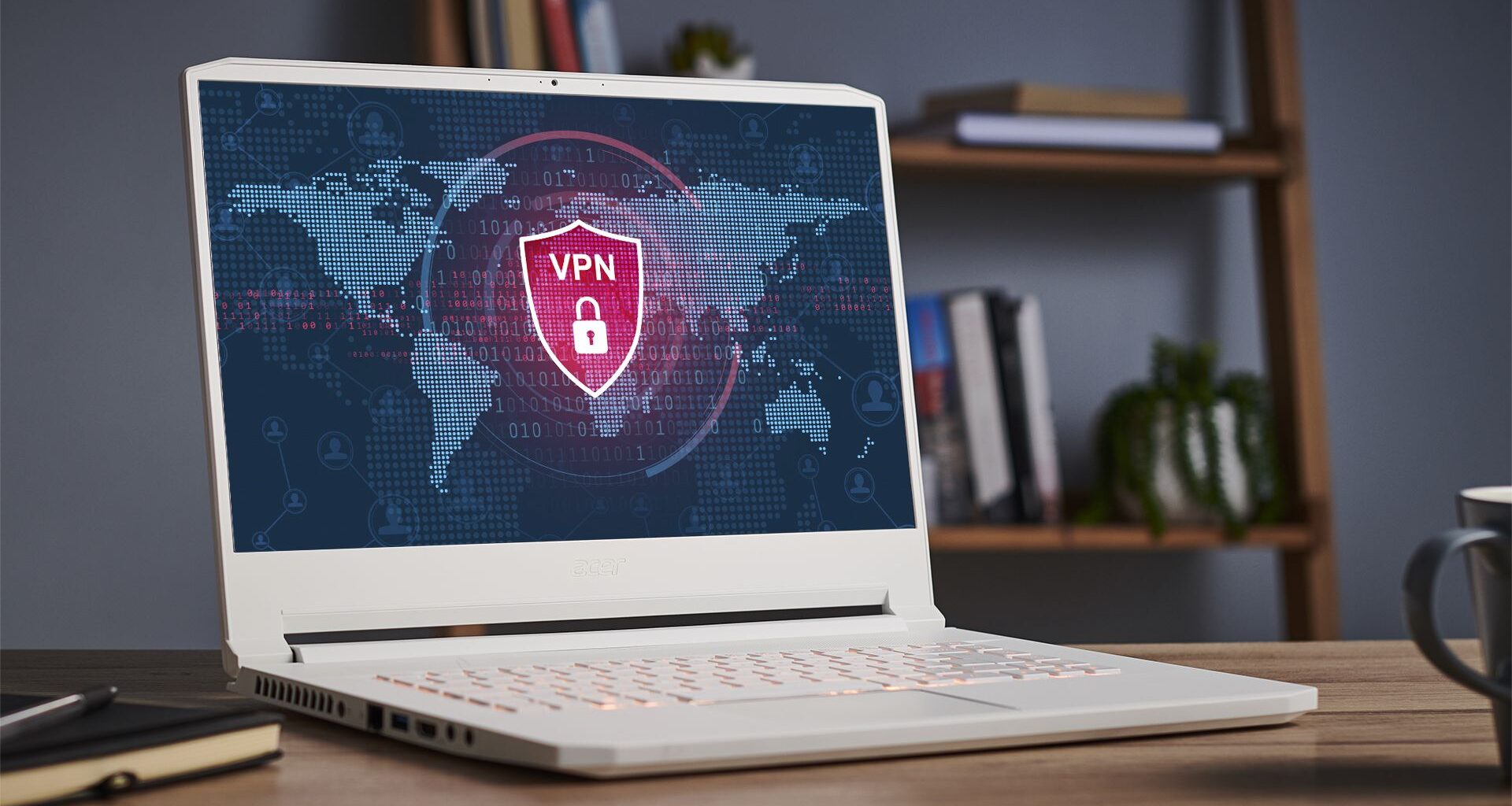 Laptop with a VPN running on the screen, on a desk with shelving in the background