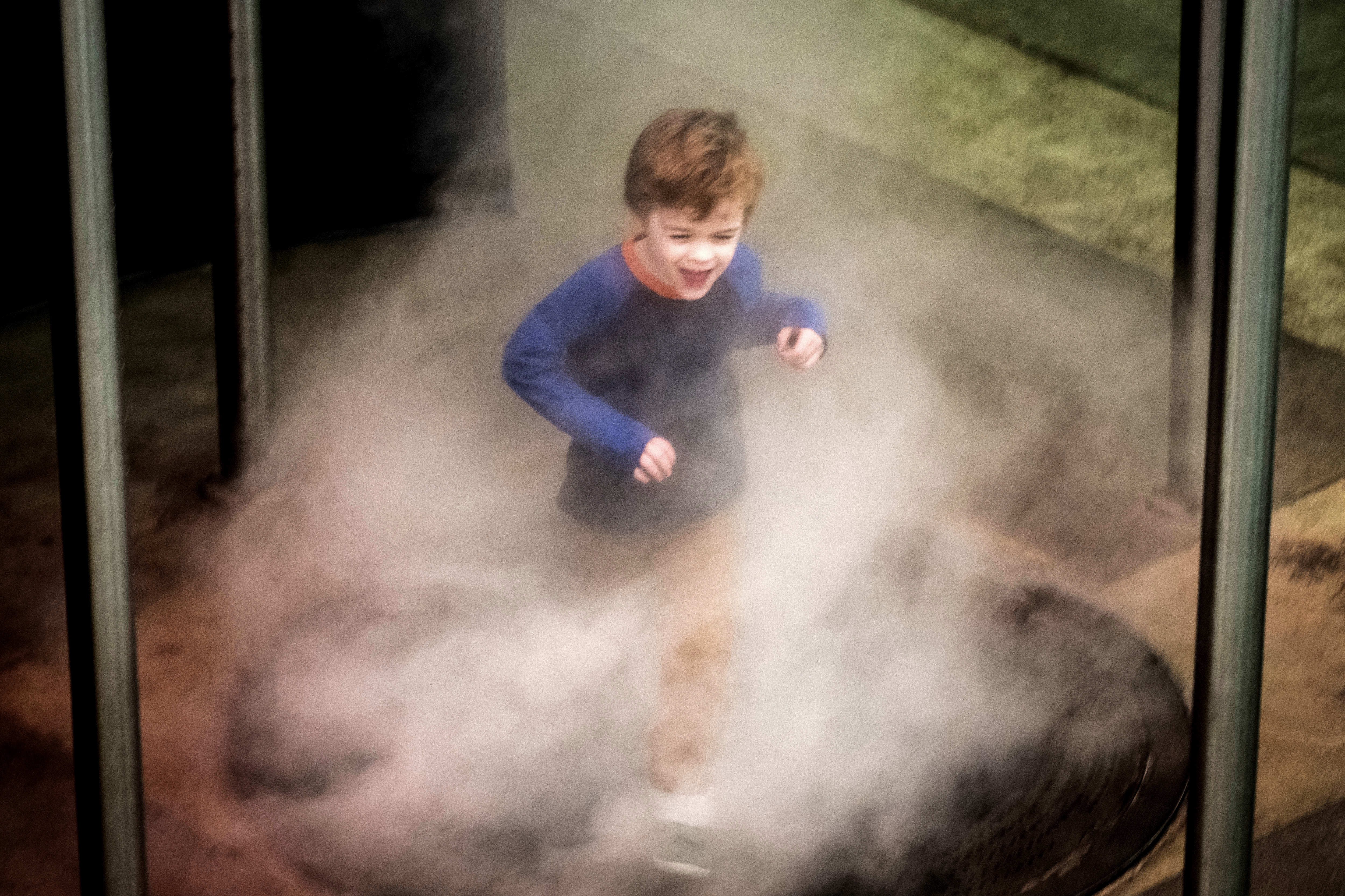 Philip Dierkes, 4, of Sherman Oaks, runs through a simulated...