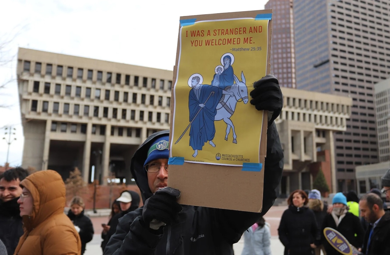 Advocates for immigrants gathered outside Boston City Hall on Thursday, Dec. 4, 2025 to condemn federal immigration enforcement action.