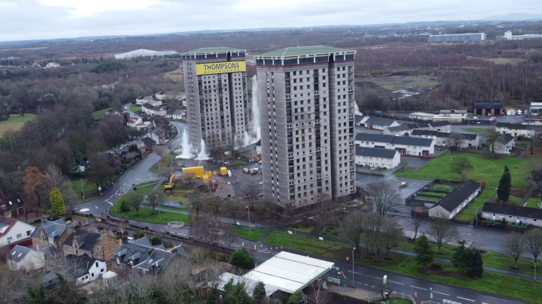 Drone footage of The 20-storey Allan, Coursington and Draffen Towers being destroyed in a single " controlled blowdown" to prepare the site for future development.