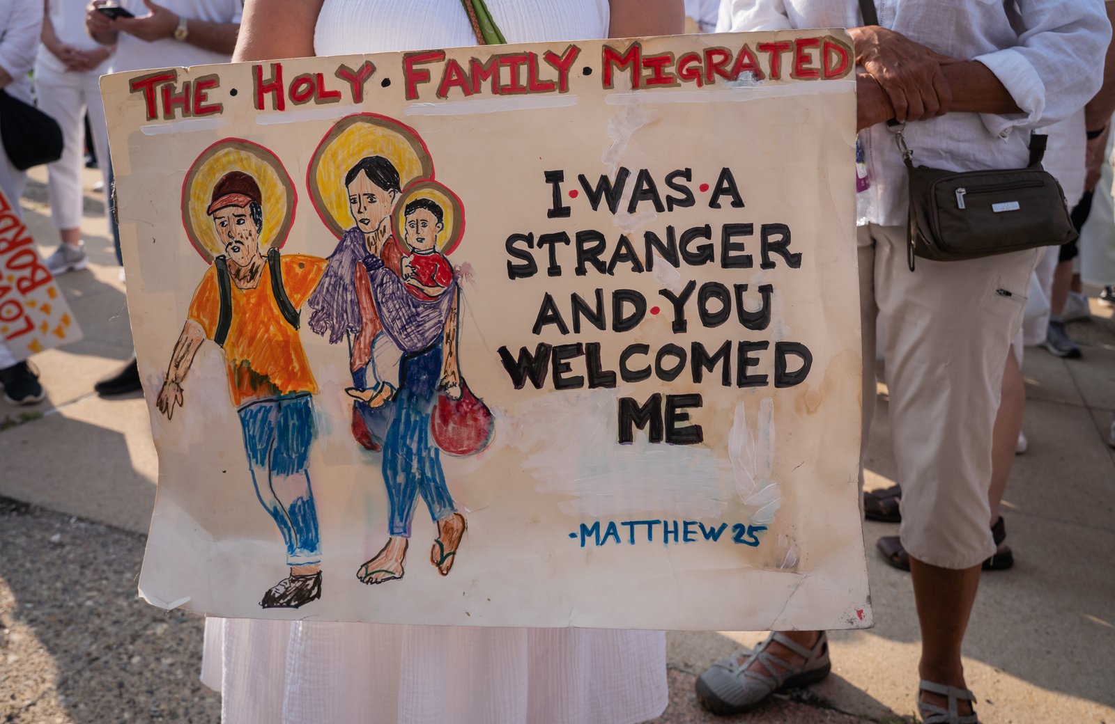 More than 300 people from two dozen parishes and other Metro Detroit churches and faith denominations took part in the July 14 procession, some carrying banners and signs supporting immigrants and calling for just and humane immigration policies and actions.