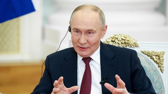 Russian President Vladimir Putin gestures during an interview at the Kremlin in Moscow, Russia, Wednesday,(AP)
