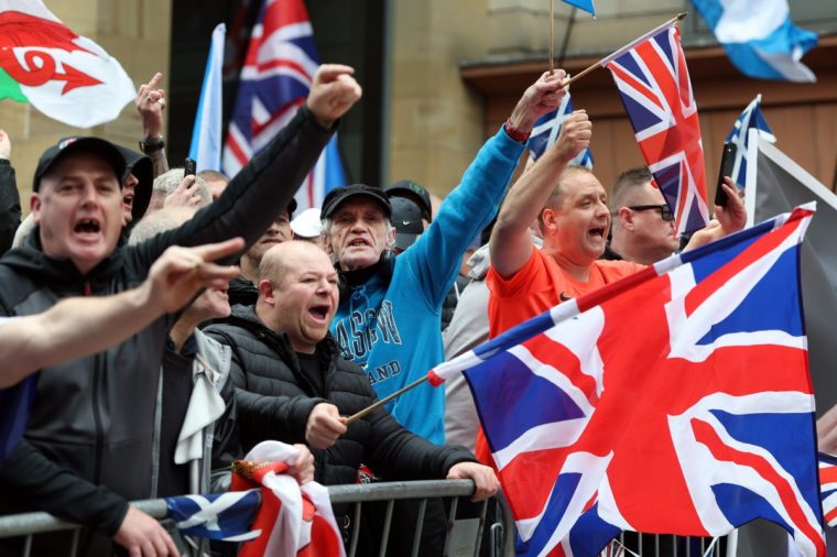 GLASGOW, SCOTLAND - SEPTEMBER 20: Anti migrant demonstrators attend a Far Right Unity Rally on September 20, 2025 in Glasgow, Scotland. Demonstrations in Scotland against migrants continue this weekend with a Far Right Unity Rally taking place in the centre of Glasgow. Take Back The Streets are also holding a counter protest, saying Aye Welcome Refugees. (Photo by Jeff J Mitchell/Getty Images)