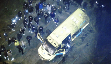 protesters surround a police van