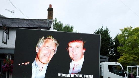 FILE PHOTO: An image of U.S. President Donald Trump alongside disgraced financier Jeffrey Epstein is displayed on a vehicle on the day of the state visit of the U.S. President and first lady Melania Trump, in Windsor, Britain, September 17, 2025. REUTERS/Phil Noble/File Photo(REUTERS)