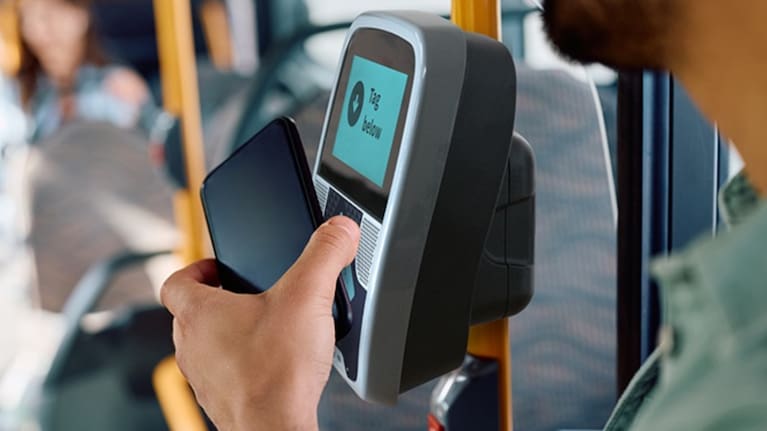 A person uses their phone on a Motu Move reader (file image).