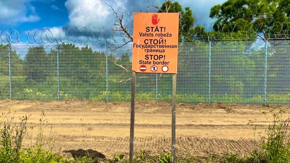 ARCHIVE - "Stop - State Border" is written in three languages on a sign on Latvia's border with Russia. Photo: Alexander Welscher/dpa