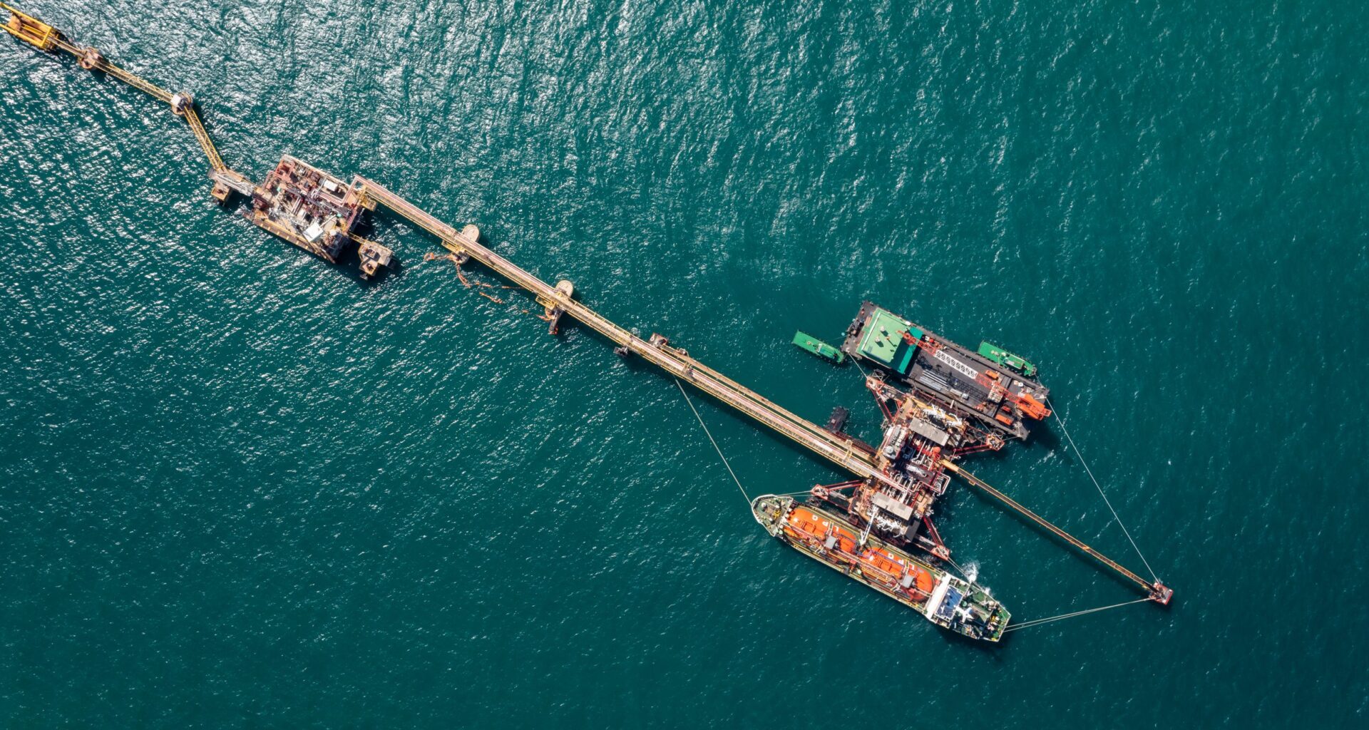 Oil pipes to oil tanker ships at pier