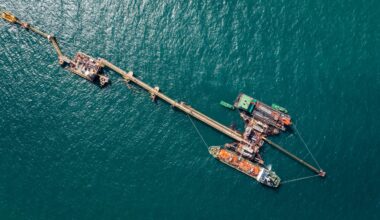 Oil pipes to oil tanker ships at pier