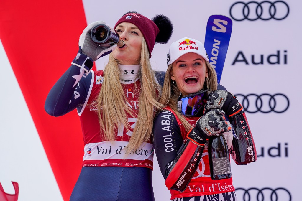 Lindsey Vonn and Alice Robinson celebrating their third-place ties at the Audi FIS Alpine Ski World Cup Women's Super G.